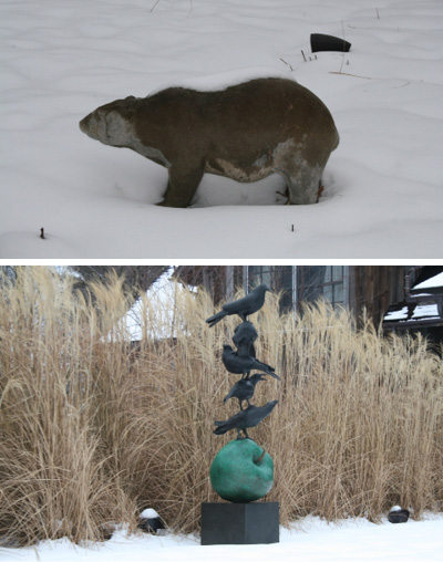 TOP: AN ANTIQUE BEAR SCULPTURE IN THE SNOW. BOTTOM: MISCANTHUS GRASS AS A BACKDROP TO A SCULPTURE BY PETER WOYTUK THAT IS PLACED ON AXIS WITH A POOL ON THE SAME WASHINGTON PROPERTY.